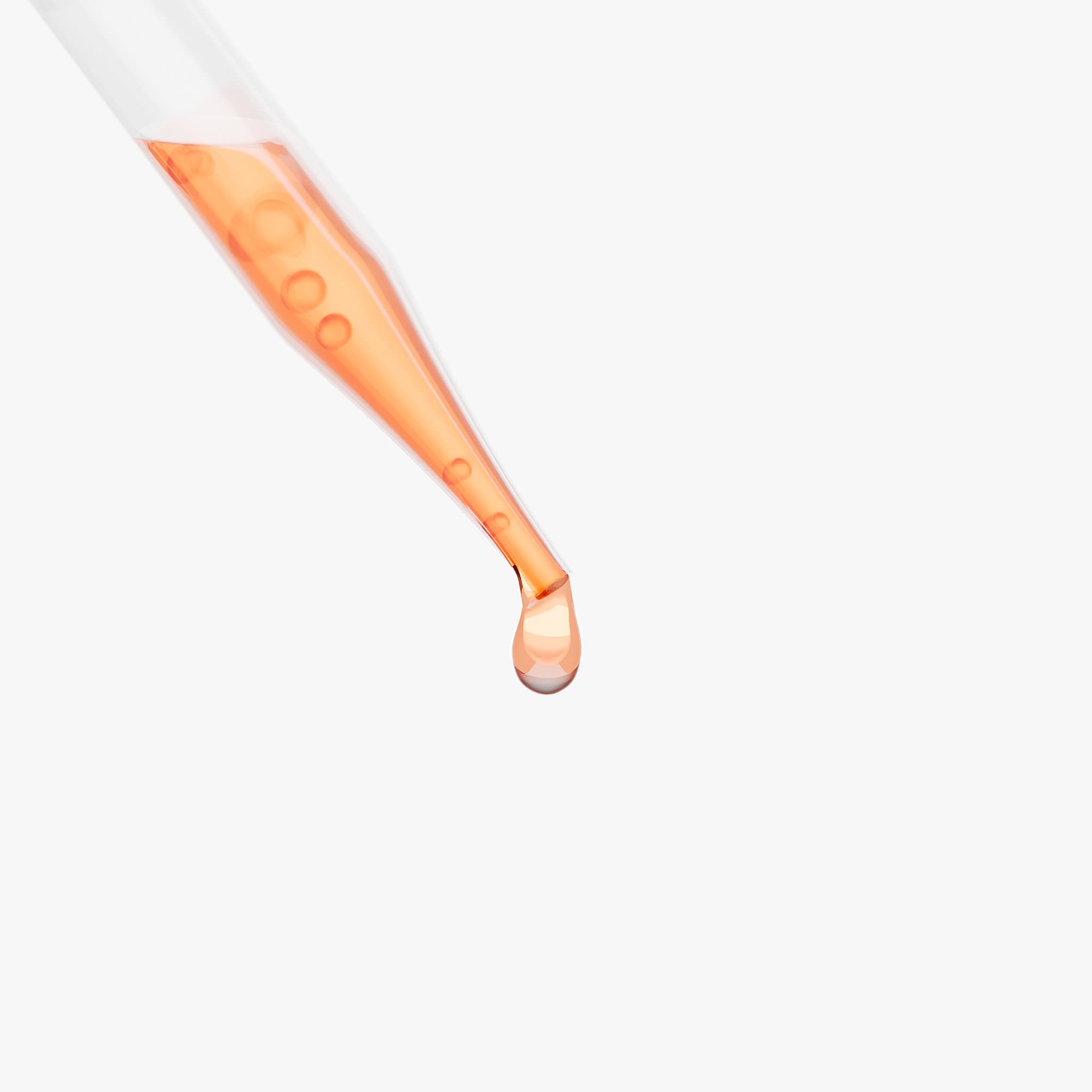 Close-up of Modern Theory dropper tip with a single amber droplet